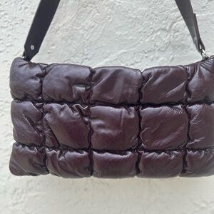 COS Pillow Quilted Oversized Shoulder bag in burgundy glossed leather.